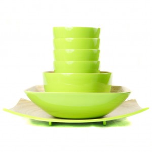Full set of eco friendly lime green bamboo bowls in different sizes and a platter.